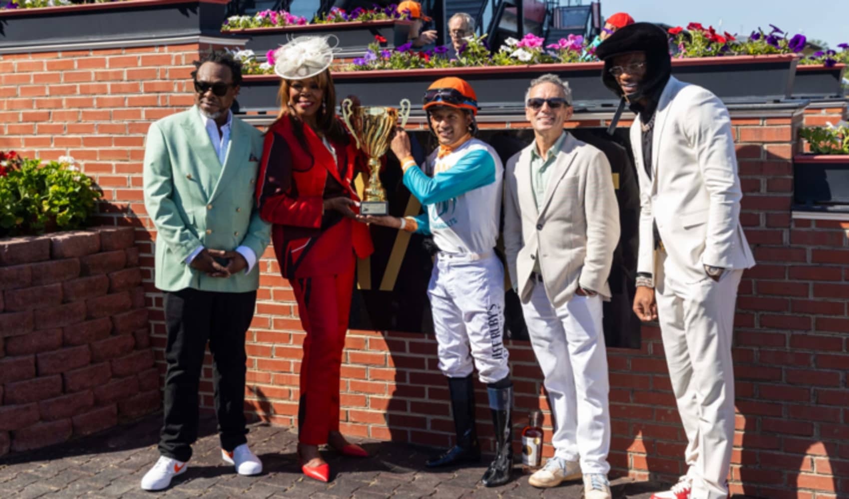 Lamar Jackson with the winners of the 2025 NTL Kickoff Race.